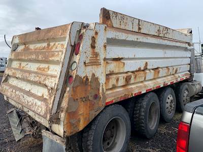 Used 17' Dump Body. Williamsen Sloped Side. Was Laid Over. Has Damage To Sides.