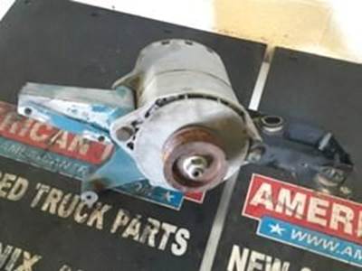 Used Alternator And Alternator Bracket For A International DT466E Engine
