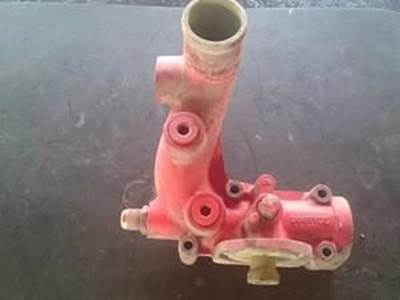 Water Pump Inlet Tube For A Cummins ISX Engine With Filter Housing