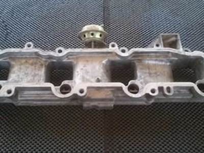 Isuzu Intake Spacer From A 4BD2 Engine