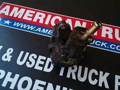 Small Power Steering Pump With Gear And Hose Nozzle From An Isuzu 4HE1 Engine.