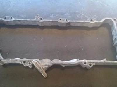 Rocker Arm Housing/Intake Valve Spacer For An Isuzu 4HK1T Engine