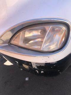 Good Used Driver Side HeAdlight With Bezel For A 2009 Freightliner CL120