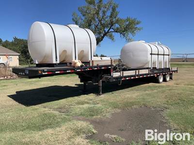 2012 Kaufman 40’ T/A Step Deck Spray Trailer