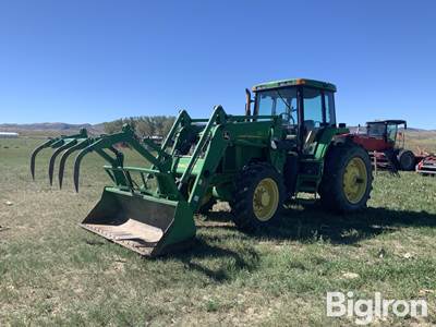 1995 John Deere 7600 MFWD Tractor w/Loader & Grapple bucket