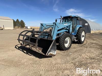 New Holland 8670 MFWD Tractor w/Grapple Loader