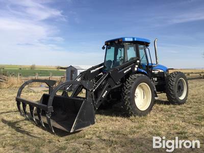 2004 New Holland TV145 4WD Tractor w/New Holland 7614 Grapple Loader Bucket