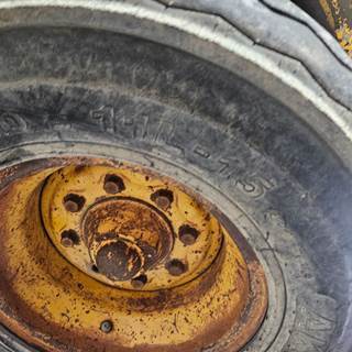 John Deere 310C Tire & Rim