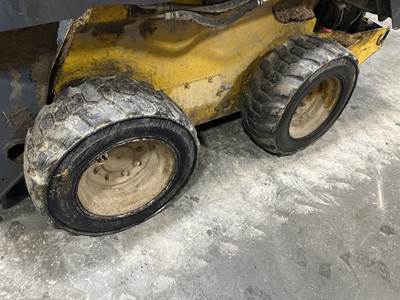 John Deere 326E Tire & Rim