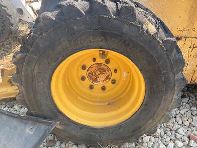 John Deere 332D Tire & Rim