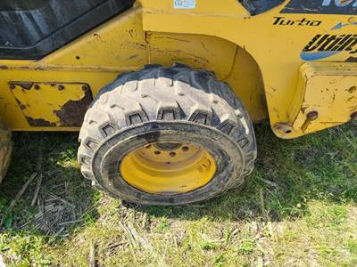 Komatsu SK1026-5N Tire & Rim