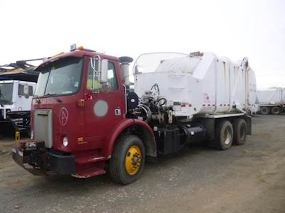 2000 Volvo WX64 Heil Sideload Garbage Truck - Cummins, 5 Speed Automatic