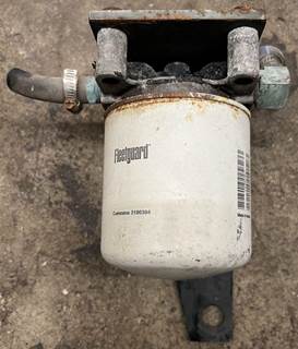 Coolant filter with bracket. Unit is in good used condition, see pictures.