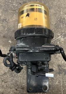 Fleetguard fuel water separator with mounting bracket. Part is in good used