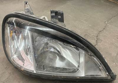 Aftermarket passenger side headlight pulled from a PACCAR truck. Headlight is in
