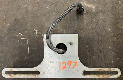 Trucklite license plate bracket with light pulled from a PACCAR truck. Bracket