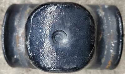 Front leaf spring bump stop / spring pad / U-bolt top plate pulled from a PACCAR