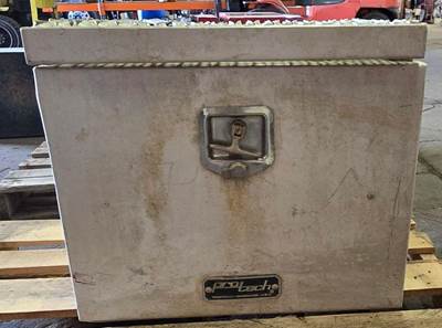 Aluminum Tool Box. Top of grate has a bend. Measures 23.5"L x 19"W x 20 5/8"H.