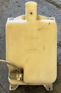 Windshield washer fluid reservoir with mounting bracket. Cap is missing from the