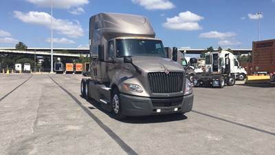 International LT Sleeper Semi Truck - 73" Raised Roof, Cummins, Automatic, Battery Powered HVAC with Optimized Idle