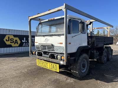 1999 Stewart & Stevenson M1083A1 T/A Flatbed Truck