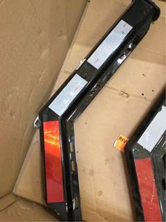 New Freightliner LH Mudflap Bracket With Reflective Tape. P/N: BTSA603025WTBL