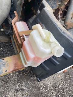Isuzu NPR HD Coolant Reservoir for a 2003 Isuzu NPR-HD