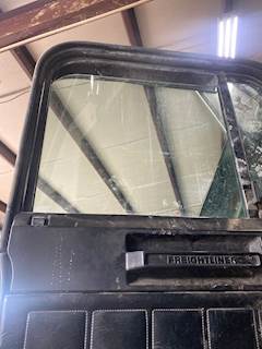 Freightliner FLD112 Door Window for a 1997 Freightliner FLD112SD