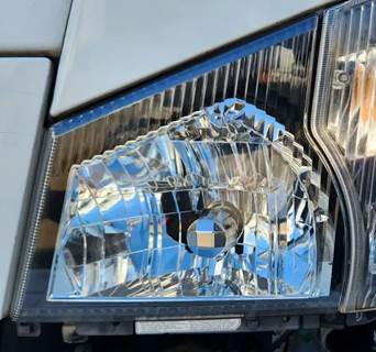 Isuzu NPR HD Headlight Assembly for a 2006 Isuzu NPR-HD