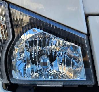 Isuzu NPR HD Headlight Assembly for a 2006 Isuzu NPR-HD