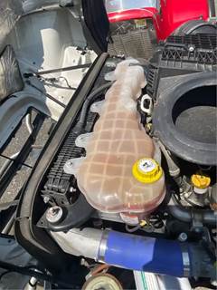 Freightliner Cascadia 116 Radiator Overflow Bottle / Surge Tank for a 2021 Freightliner Cascadia 116 Day Cab