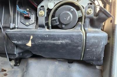 Isuzu NPR HD Windshield Washer Reservoir for a 2006 Isuzu NPR-HD