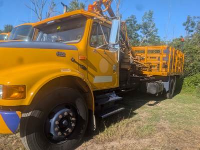 2001 International 4700 Post Driver with Rack Body