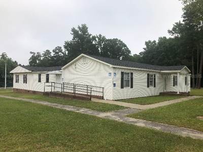 Approx. 3200 Sq. Foot Building with 9 Rooms, 4 Restrooms and a Kitchen