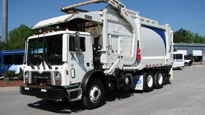 Mack TE64 with Heil Front Loading Refuse Body