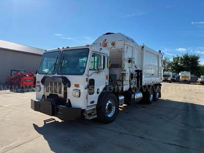 2020 Peterbilt 520 with a Heil DuraPack Python Automated Side-Loader Garbage Truck
