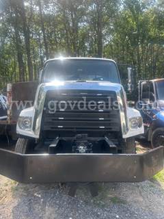 Asphalt tac truck with damage on the passenger side to the aluminum skin. Truck still functions and works as it should