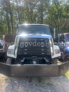Asphalt tac truck with damage on the passenger side to the aluminum skin. Truck still functions and works as it should