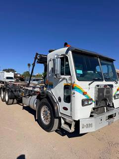 2009 Peterbilt 320 6x4 COE Roll-Off Truck