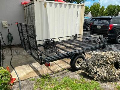 utility trailer designed for hauling ATVs or golf carts
