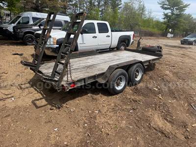 Equipment trailer with wood deck.