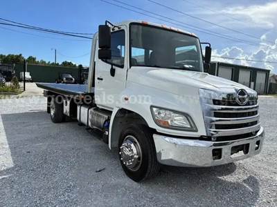 2013 Hino Conventional Cab with a Chevron wrecker roll off & wheel lift attachment