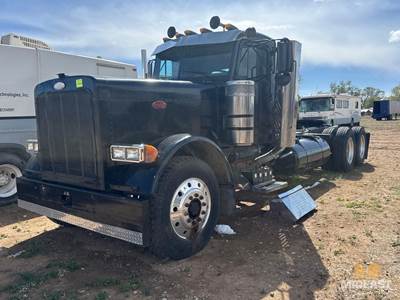 Peterbilt Tandem Axle Day Cab Semi Truck. Heavy-Duty Setup With Dual Rear Axles