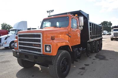 International 2574SF Quad Axle Dump Truck - Cummins 370HP, 8Ll Manual, 16' Dump