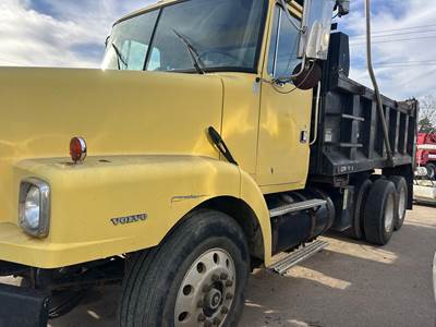 Volvo WG64 Dump Truck - Caterpillar 300HP, 10 Speed Manual, 14' Dump