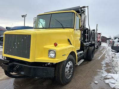 Volvo WG64 Dump Truck - Caterpillar 300HP, 10 Speed Manual, 14' Dump