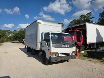 Isuzu NPR 2002, 4HE1 $3500, Jatco $1000, Rear, $1000, Doors $400, Bumper $350,