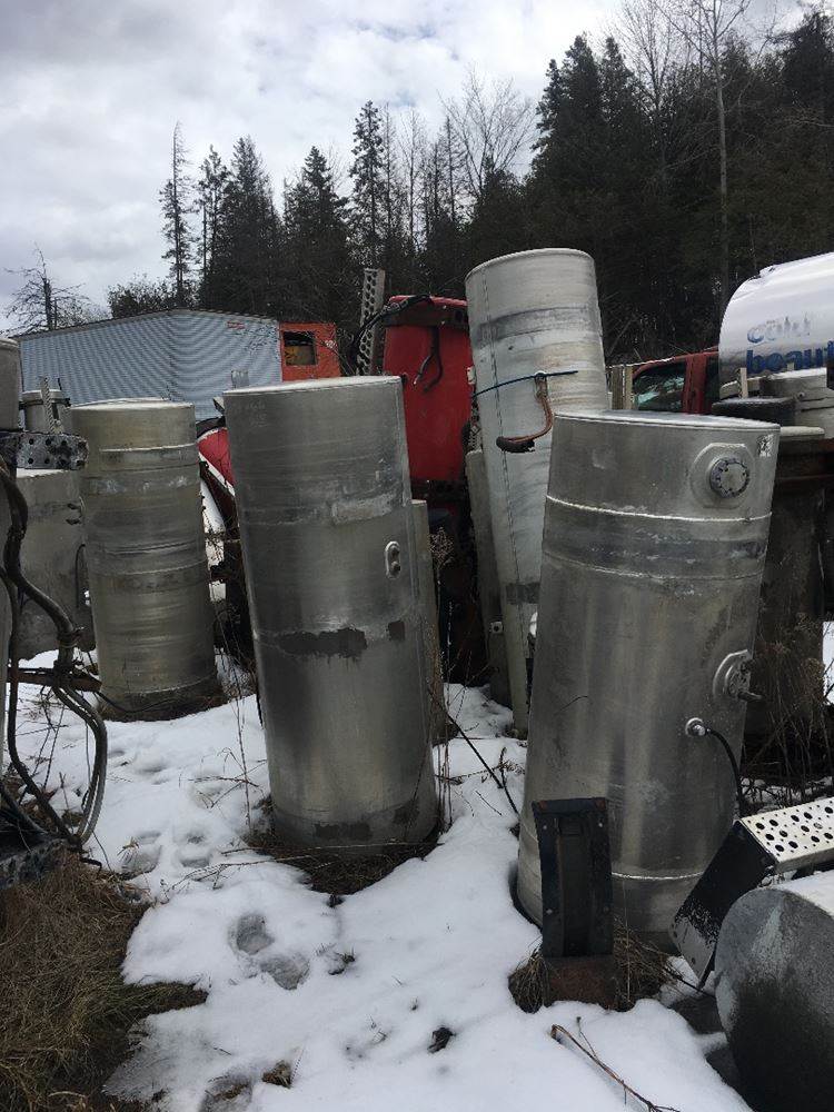 Several Fuel Tanks Of Various Sizes, Dimensions And Truck Applications