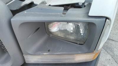 Ford F-550 Left Headlight Bezel for a Ford F550SD (SUPER DUTY)