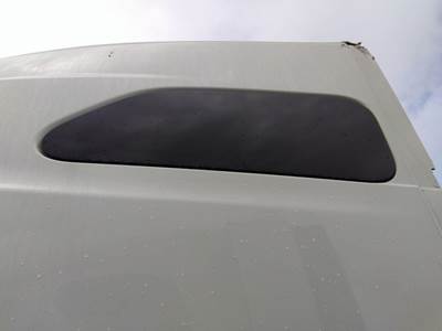 International LT Left Sleeper Window